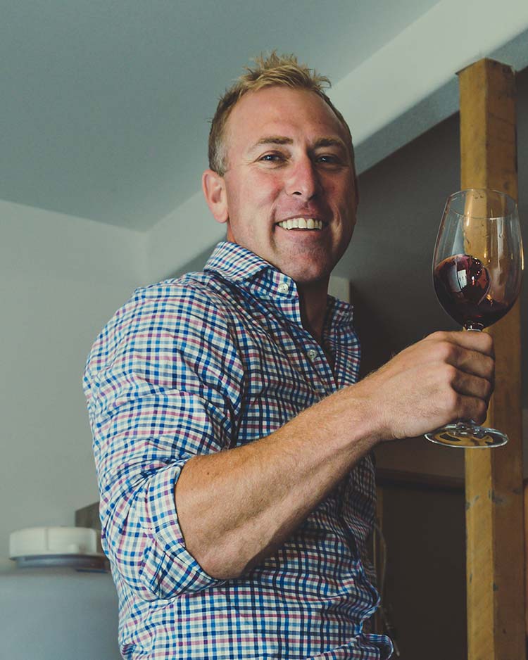 Portrait of Dan Brink Holding a Wine Glass Ready to Showcase a Tasting at Pomeroy Cellars